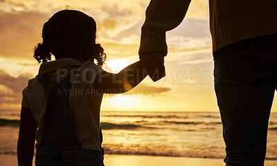 Buy stock photo Sunset, beach and girl holding hands with father and silhouette for summer, family and vacation together. Hope, support and love with dad and child for holiday, travel and relax with ocean waves