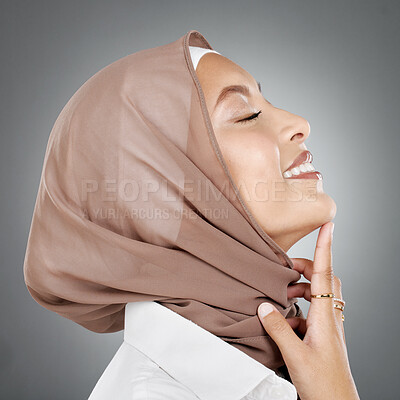 Buy stock photo Face, beauty or skincare with a woman muslim wearing a hijab in studio on a gray background for natural wellness. Cosmetics, happy and skin with an Islam female in a headscarf to promote health