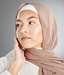 Hijab fashion, muslim woman beauty and skincare, makeup and aesthetic cosmetics on studio background. Islamic religion, brown scarf and face headshot of young Saudi Arabia girl, culture and elegance
