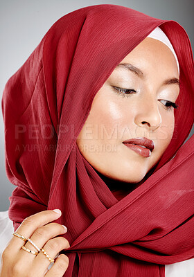 Buy stock photo Hijab, muslim and fashion of woman in beauty headshot with red lipstick, makeup or cosmetics in studio background mock up. Islamic culture, fabric and designer arabic model wearing scarf with mockup