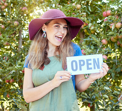 Buy stock photo Woman, fruit farm and open store sign of a happy entrepreneur for agriculture and apple orchard. Female manager proud and success smile with sustainable, eco friendly ecology and green farming trees 