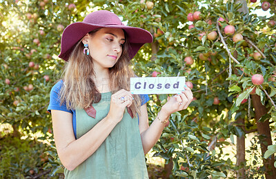 Buy stock photo Woman farmer, closed sign and apple farm, agriculture worker and sustainability business. Farming employee with icon or board for advertising end of fruit garden collection season or work day outdoor