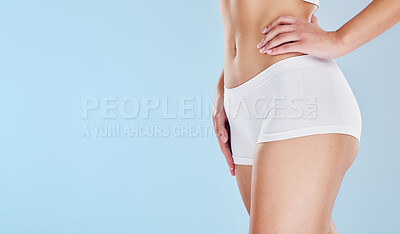Buy stock photo Fitness, health and weight loss with stomach of woman in underwear for wellness, sexy or mockup. Workout, diet and exercise with abdomen of model for nutrition, lifestyle or luxury in blue background