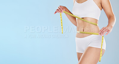Buy stock photo Tape measure, stomach and woman health diet, fitness and detox weight goals, target and abdomen on mockup blue background. Liposuction, tummy tuck and wellness model, bmi progress and skinny body fat