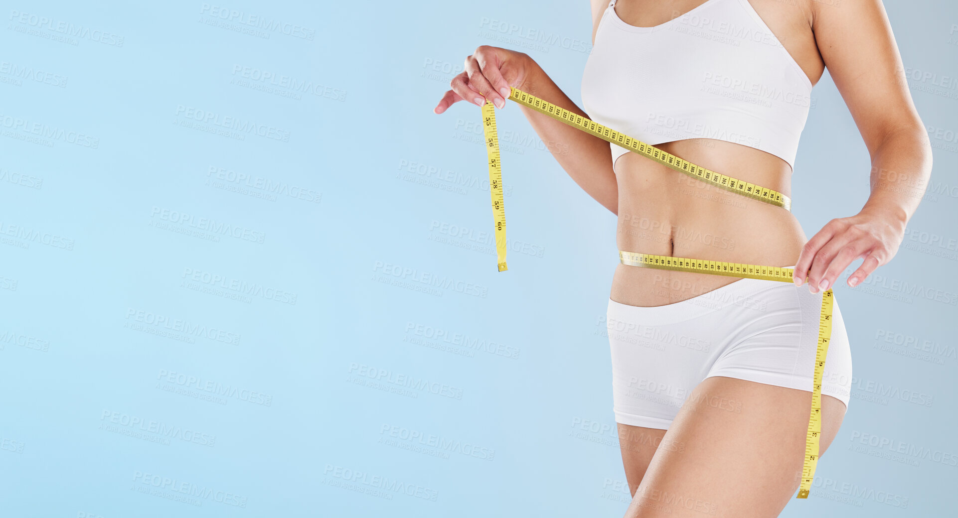 Buy stock photo Tape measure, stomach and woman health diet, fitness and detox weight goals, target and abdomen on mockup blue background. Liposuction, tummy tuck and wellness model, bmi progress and skinny body fat