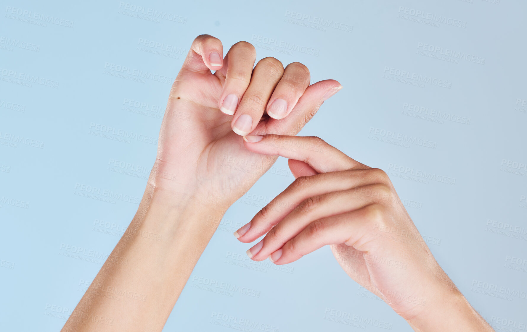 Buy stock photo Manicure nails, care and hands of woman fresh from self care, wellness beauty spa or nail salon on studio mockup. Nail care, soft skin and clean palm of skincare girl isolated on blue background