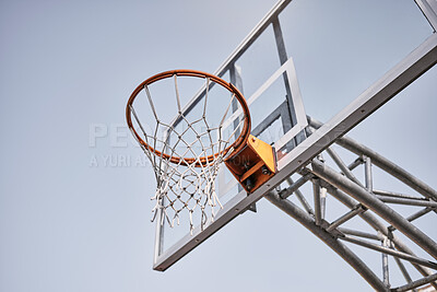 Buy stock photo Basketball court, fabric or goals net for match, competition game or fitness in low angle on blue sky in New York. Basketball hoop, texture or sports exercise for training, wellness or winner workout
