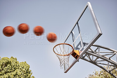 Buy stock photo Basketball, point and ball in basket for winning score on basketball court in park with summer sky. Game, sports goals and training practice with motion, action and motivation for winner shot in hoop