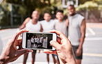 Basketball, phone and screen with people team photo for game, competition or outdoor social media post. Athlete sports group of men with cellphone after practice, training and workout on sport court