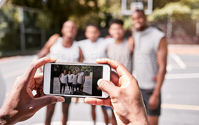 Buy stock photo Basketball, phone and screen with people team photo for game, competition or outdoor social media post. Athlete sports group of men with cellphone picture after training and workout on sport court