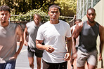 Men, group and running on basketball court with motion blur for exercise, training and together in sun. Team, basketball and fast in workout, teamwork and fitness for wellness, sports and health