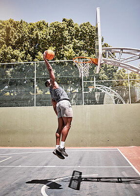 Buy stock photo Basketball dunk, sport and strong black man athlete on a outdoor basketball court with fitness. Sports person basketball player with cardio workout, exercise and training game healthy and strong