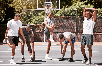 Buy stock photo Fitness, exercise and basketball men stretching or workout their body on a sport court. Training male athletes prepare muscle warm up before practice or game at a sports venue or club for health