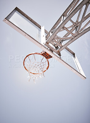Buy stock photo Basketball, sports and net with a hoop on a court on a cloudy day from below for training or exercise. Fitness, workout and health with sport equipment outdoor for practice or a competitive game 