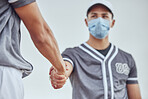Baseball player, game and handshake for playing, respect and mask for covid 19, pandemic and coronavirus. Man, sports and ppe for safety together at baseball match, contest or competition in New York