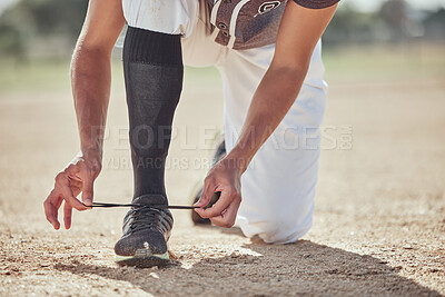 Buy stock photo Baseball, sports and athlete tie laces of shoes to prepare for a match or training on an outdoor field. Softball, sneakers and active man getting ready for a game or practice on a sport pitch.