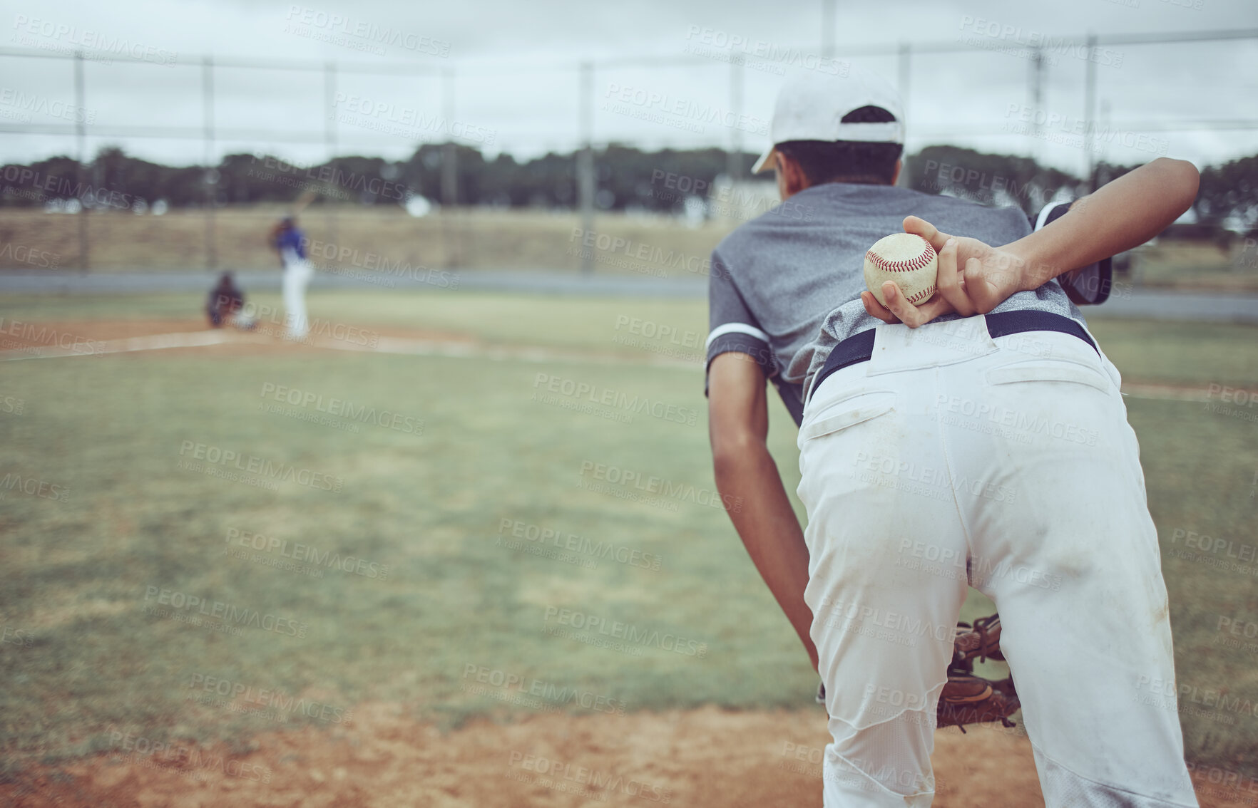 Buy stock photo Baseball, baseball player and ball on back on baseball field ready to pitch in competition, game or match. Fitness, sports and pitcher preparing to throw for training, exercise or workout outdoors.

