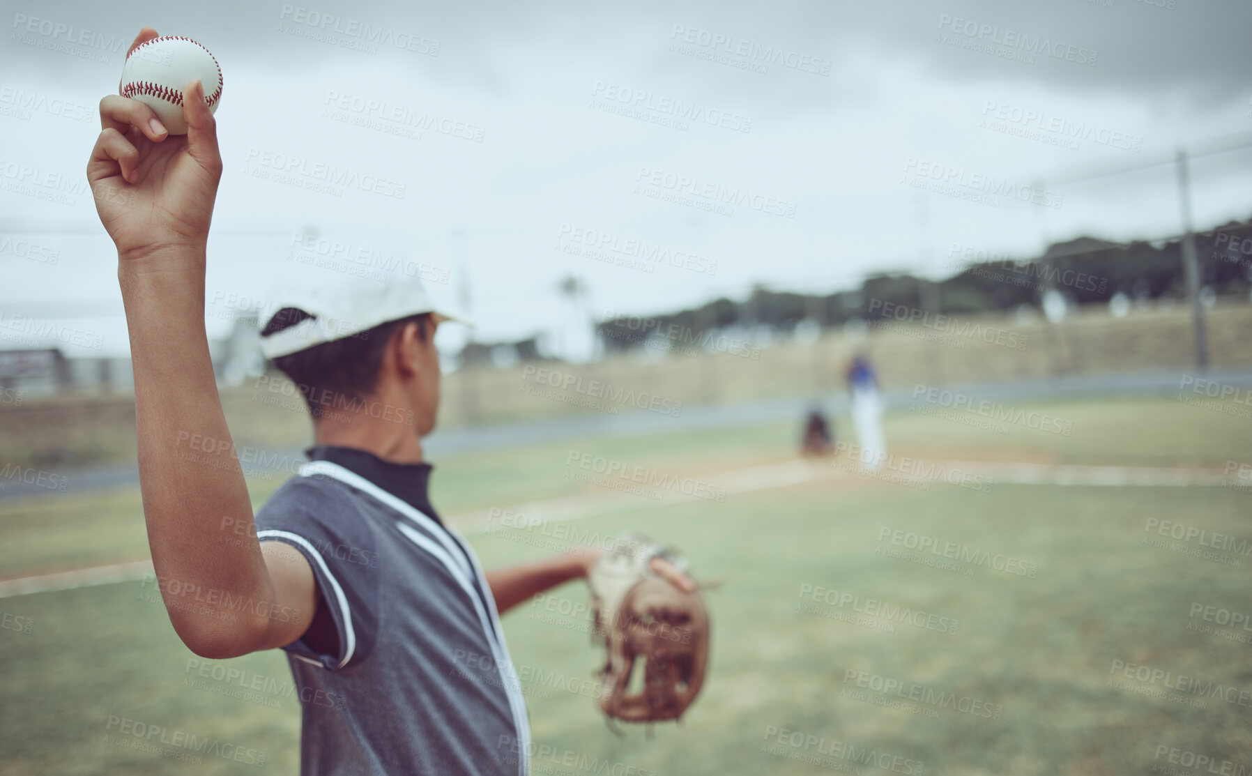 Buy stock photo Baseball, pitcher and athlete throwing a ball on an outdoor field during a game or training. Fitness, sports and softball player practicing his skill at match or exercise on outside pitch or stadium.