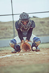 Baseball, sports and ball with a catcher on a grass pitch or field during a game or match outdoor. Fitness, exercise and catch with a male baseball player playing a competitive sport outside