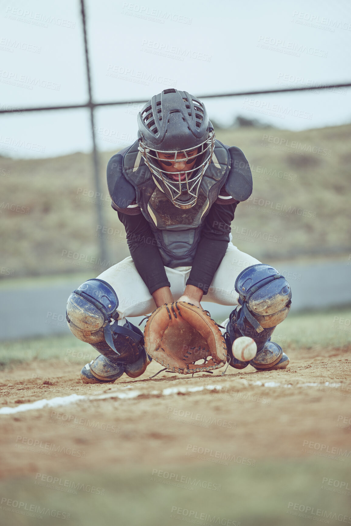 Buy stock photo Baseball, sports and ball with a catcher on a grass pitch or field during a game or match outdoor. Fitness, exercise and catch with a male baseball player playing a competitive sport outside