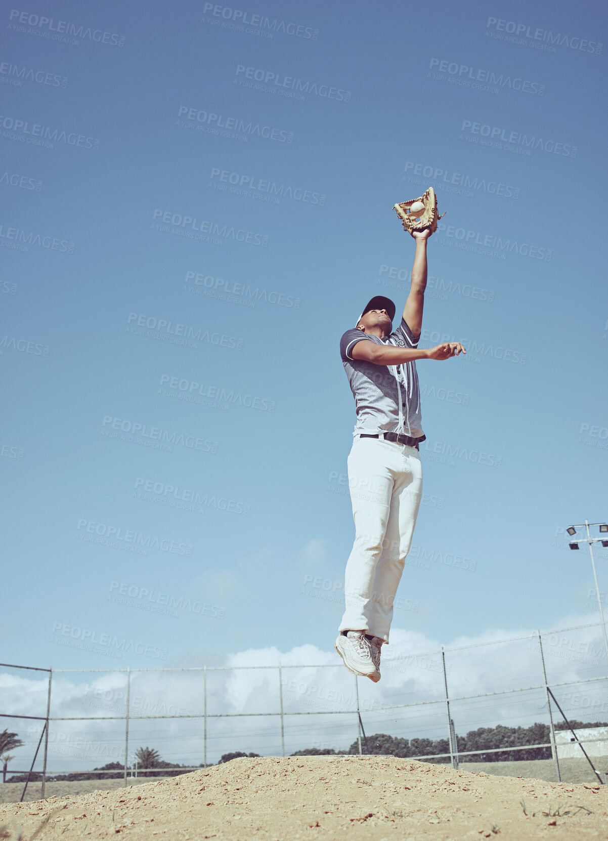 Buy stock photo Baseball, athlete jump and sports game, man and fitness on baseball field with exercise, play and pitch outdoor. Competition, competitive and sport motivation with baseball player and active life.  