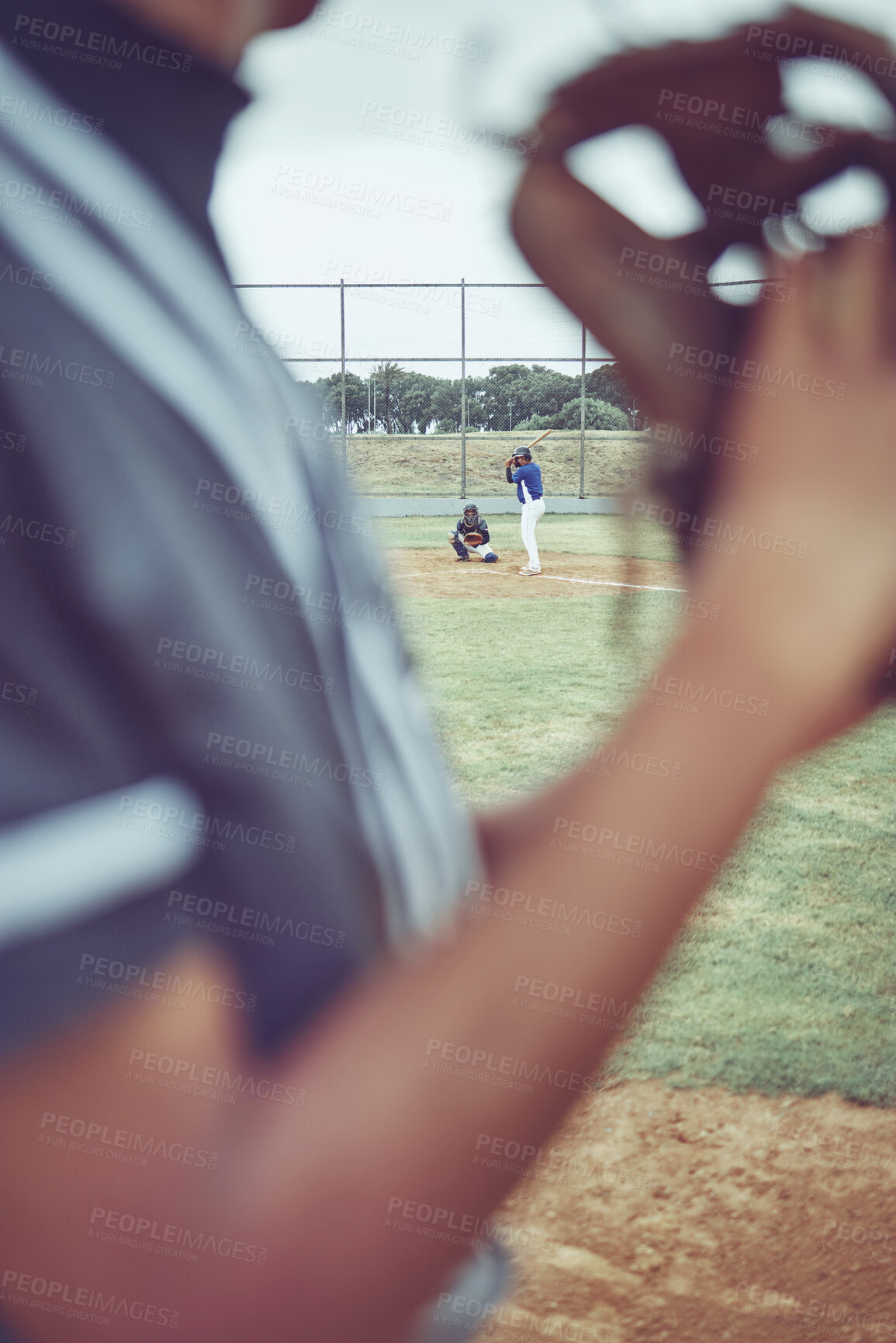 Buy stock photo Baseball, sports and fitness with a batter and pitcher on a grass pitch or field during a game or match. Exercising, training and workout with a baseball player playing in a competitive sport