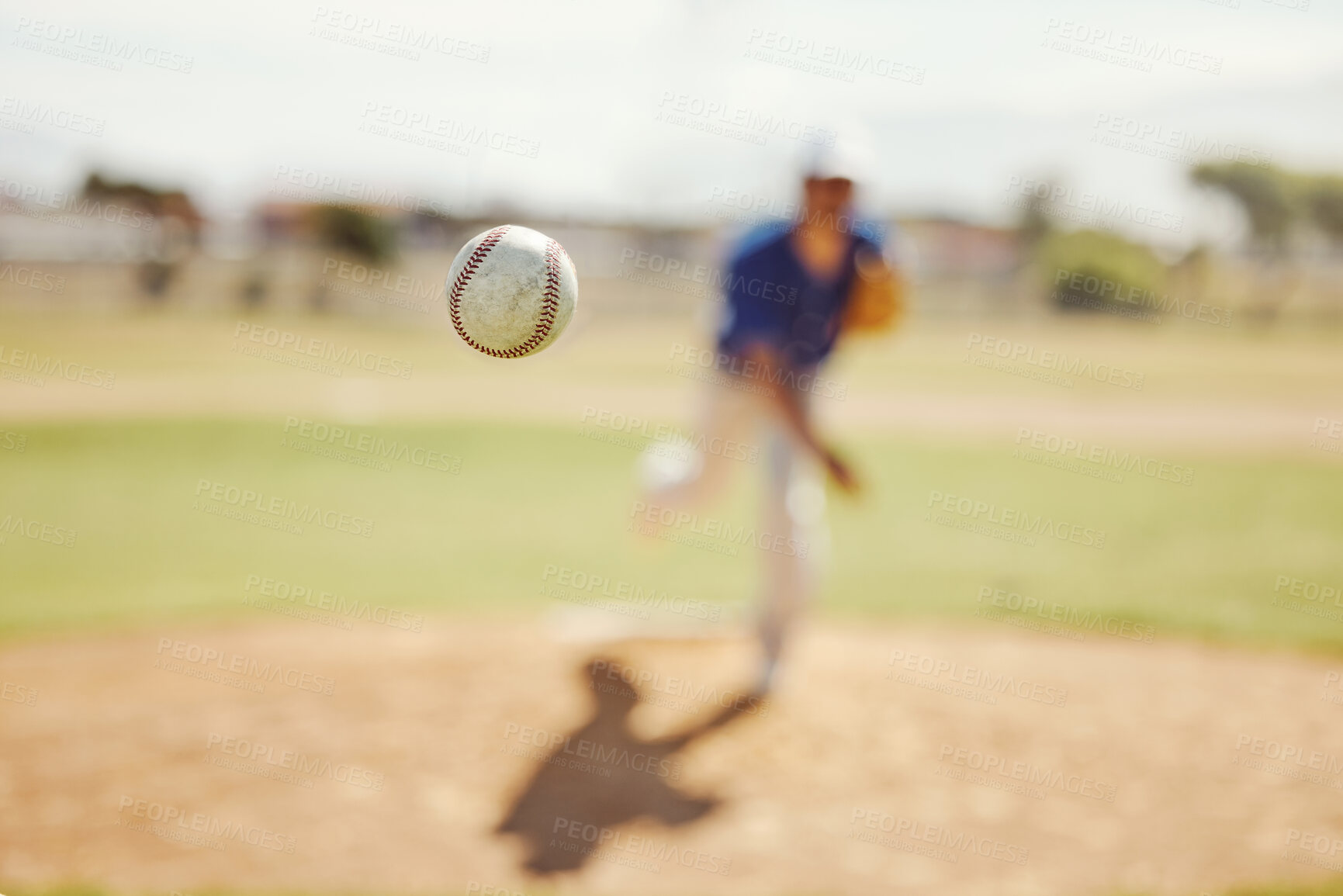 Buy stock photo Sports, pitch and baseball ball in air, pitcher throwing it in match, game or practice in outdoor field. Fitness, exercise and training on baseball field with player in action, movement and motion