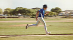 Baseball, sports and man running on a field during a game, professional event or training. Fast, speed and athlete doing run while playing sport at ground, park or in nature for fitness and exercise