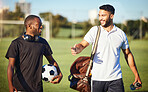 Soccer players, friends and men walking on football field after practice or fitness training on grass field. Diversity, smile and football players talking, bonding or discussion after sports workout.