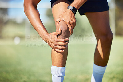 Buy stock photo Sport injury, knee and fitness, soccer field and muscle with pain, soccer player hurt and exercise training. Athlete, hands on injured leg, physical activity and sports, healthy and active lifestyle