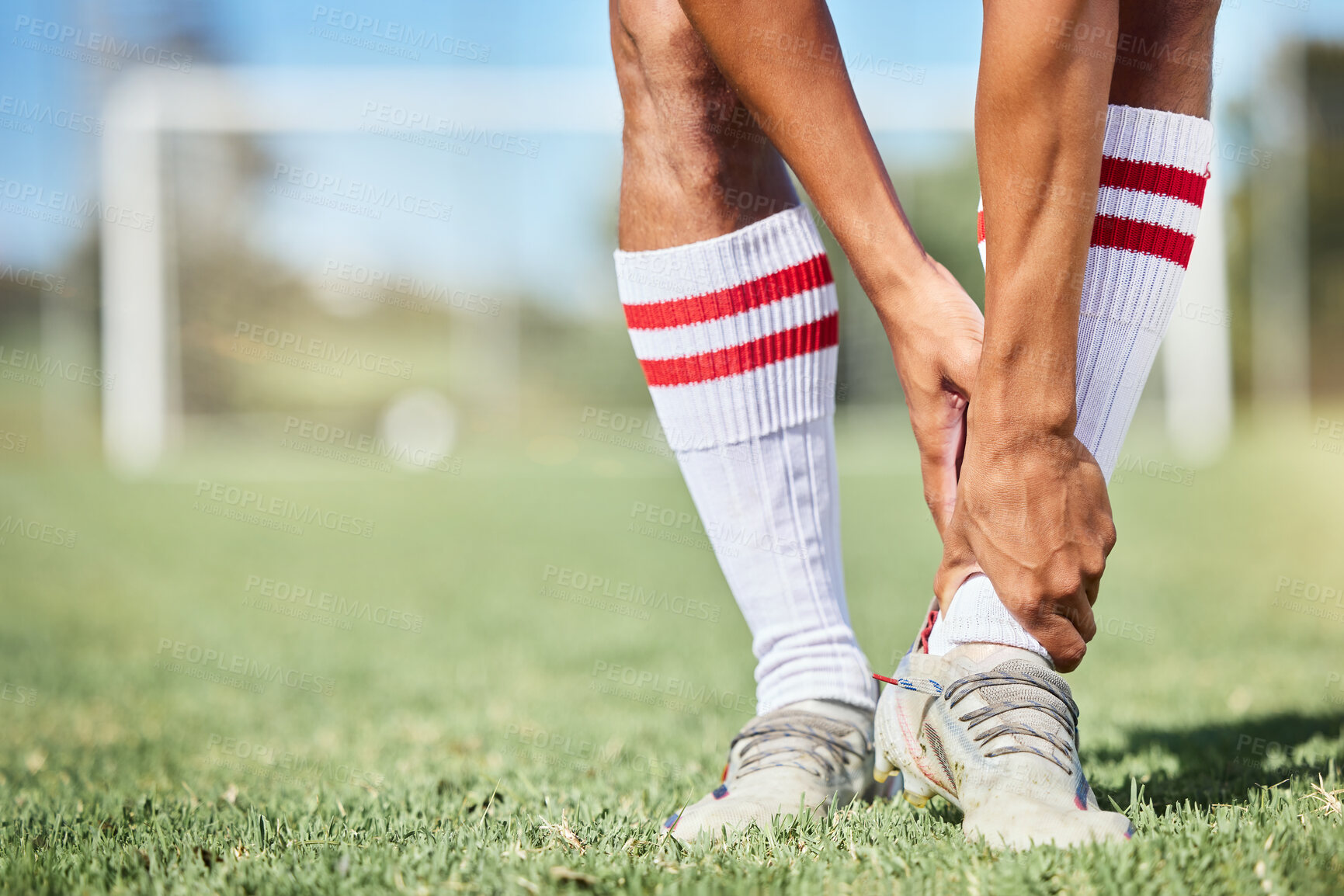 Buy stock photo Soccer, sports and ankle pain, injury or accident on a field during a game, exercise or training. Muscle sprain, broken joint or medical emergency of a man athlete at a football pitch during a match.