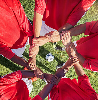 Buy stock photo Soccer, hands and team sport with support before match, game or training with ball in circle group of men. Top of football field, pitch and grass with people showing trust, motivation and teamwork