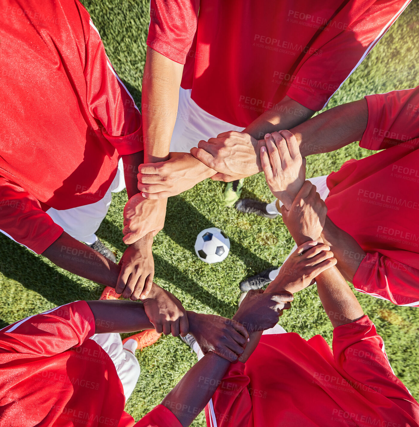 Buy stock photo Soccer, hands and team sport with support before match, game or training with ball in circle group of men. Top of football field, pitch and grass with people showing trust, motivation and teamwork