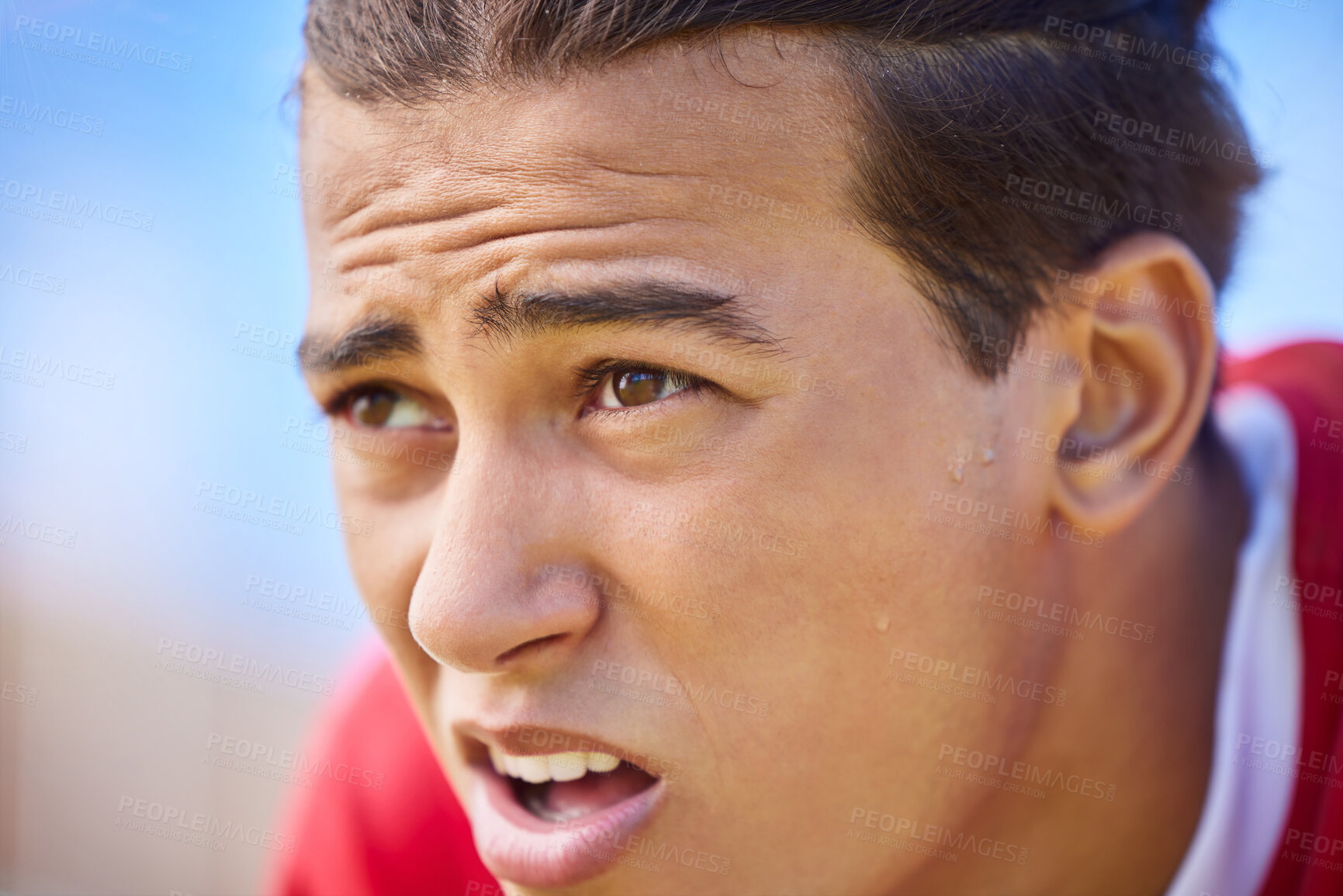 Buy stock photo Soccer player, tired and sweat on face after sports training, game or match feeling exhausted and breathing heavy outdoor after workout. Football, exercise and athlete man taking a break on pitch