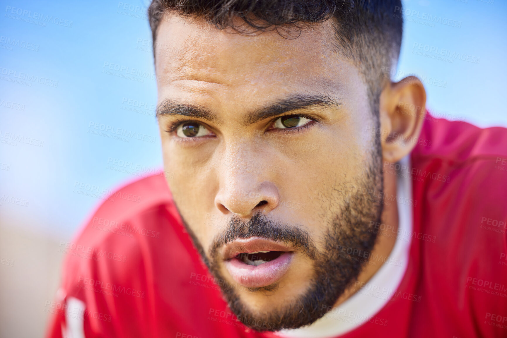 Buy stock photo Soccer, sports and tired with a man athlete looking exhausted while breathing during a game or match outdoor. Fitness, football and workout with a young male player out of breath during training