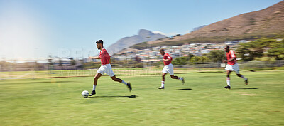 Soccer player, running and soccer ball team sports competition game, grass pitch and goals of winning score in South Africa. Motion blur professional athlete, football field action and outdoor energy