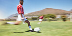 Action, soccer player and man kick soccer ball on grass pitch, sports competition and team game, goals and winning score. Motion blur football field athlete, running action or outdoor training energy