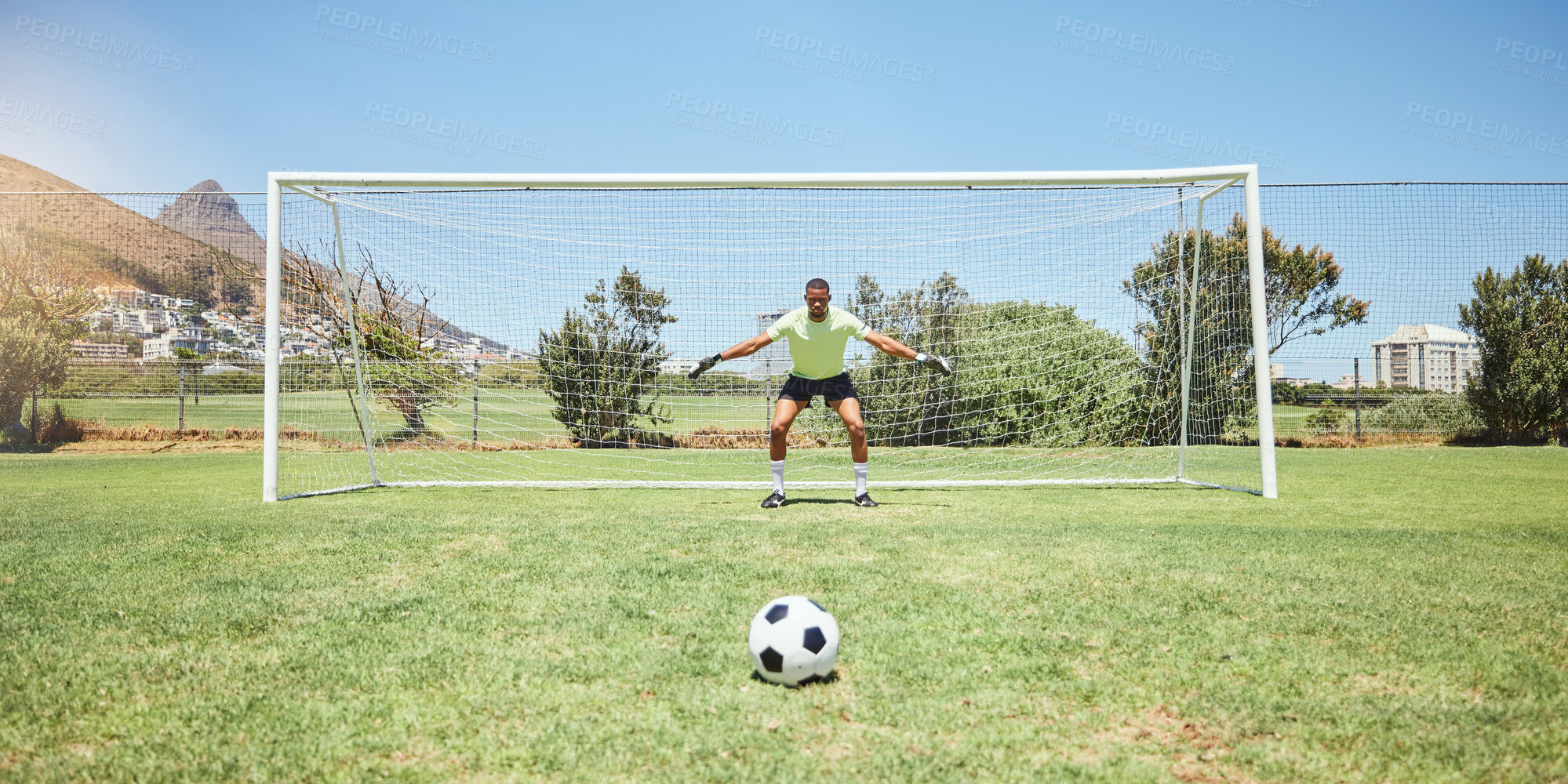 Buy stock photo Goalkeeper, soccer field and sports man ready in penalty kick, competition game challenge and football field pitch defense. Goalie protect net goals, stop soccer ball score and football player target