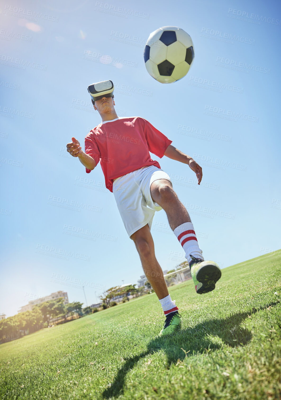 Buy stock photo Soccer player, vr and football for kick with man outdoor on field, pitch or park in sunshine. Football play, virtual reality and metaverse for training, exercise or workout in summer with soccer ball