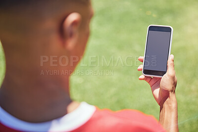 Buy stock photo Man, soccer player and phone on field with screen, blank and mockup on the internet. Man, football player and smartphone on social media, web or app at training, game or sport on pitch at contest