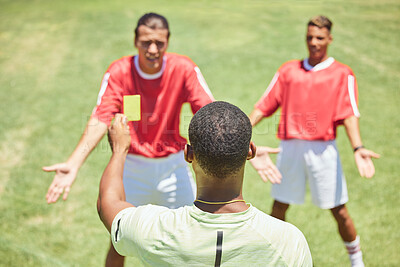 Buy stock photo Soccer, team and referee with yellow card, booking and foul a player on a grass pitch or field during a game. Fitness, football and discipline with a man ref giving a caution during a sports match

