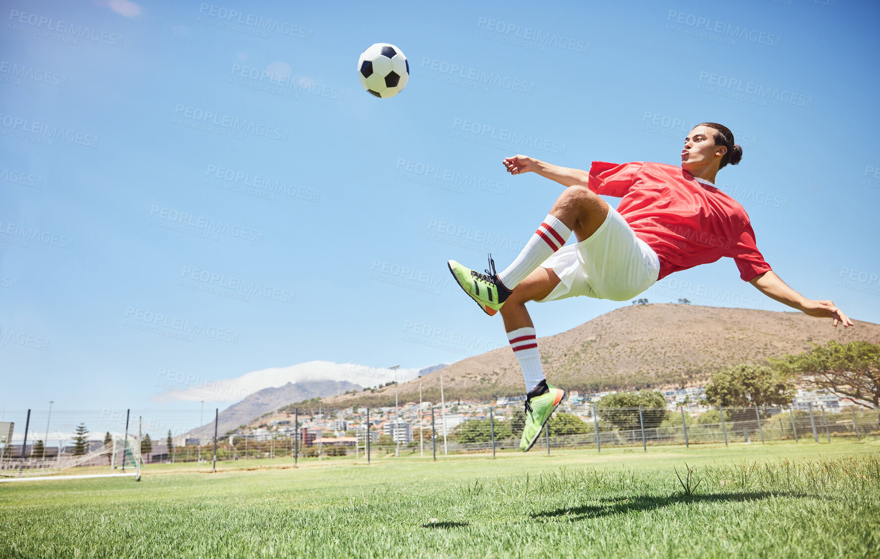Buy stock photo Fitness, soccer and athlete scoring a goal at a game or sports training at an outdoor field. Skill, jump and man football player practicing a kick and score with ball exercise on pitch for motivation