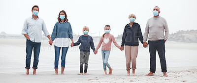Buy stock photo Covid, walking and family at the beach with face mask on, holding hands with grandparents, parents and children. Big family on a walk, stroll and relax by the ocean after covid 19 pandemic lockdown