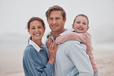 Buy stock photo Happy family, mother and father with child at a beach enjoying winter holiday vacation and bonding outdoors. Smile, mom and girl hugging dad, relaxing and spending quality time at an ocean in Sydney