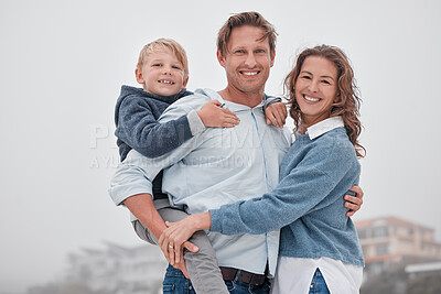 Buy stock photo Family, children and beach with a boy and parents by the sea or ocean for a holiday on a misty day. Portrait of kid, love and nature with a mother, father and daughter by the water during autumn