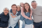 Family, happy and kids hug with funny quality time with a smile and elderly people. Portrait of senior grandparents, parents and children laughing with happiness, love and care together smiling