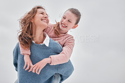 Buy stock photo Family, love and piggyback with a girl and mother bonding outdoor in the early morning against a gray sky. Happy, smile and together with a woman and daughter spending time during overcast winter