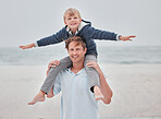 Child, dad and piggy back on beach on a family holiday ocean walk in Australia. Travel, fun and a portrait of happy father and son with smile walking on sea sand on vacation with open sky and waves.