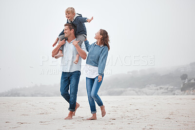 Buy stock photo Family, children and beach with a mother, father and boy walking on the sand while on holiday or vacation. Nature, summer and travel with a man, woman and boy child taking walk together on the coast