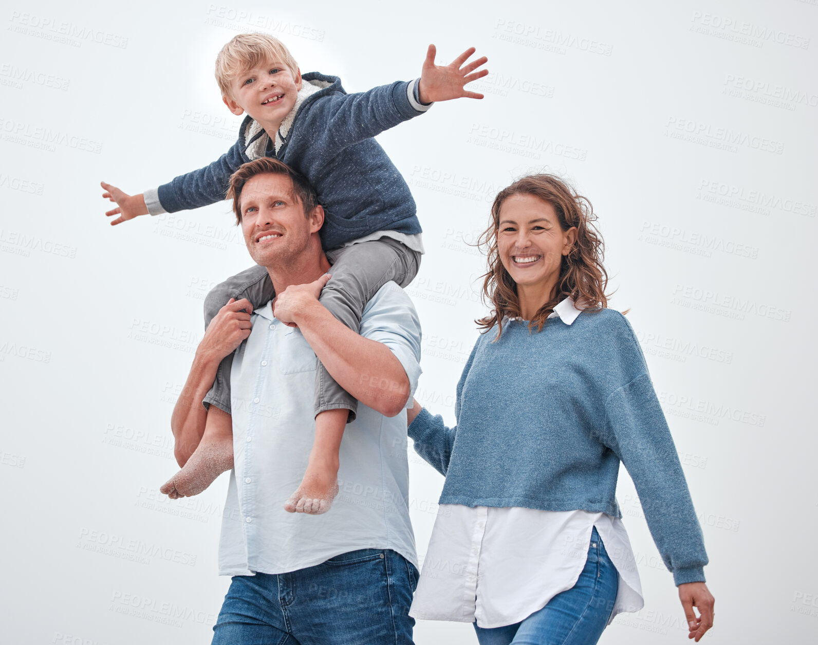 Buy stock photo Dad, boy and shoulders for walk, family and smile together outdoor in sunshine with happiness. Father, mother and child in summer, happy and walking for bonding, relax and love on vacation in Madrid